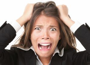 Woman pulling her hair out in stress